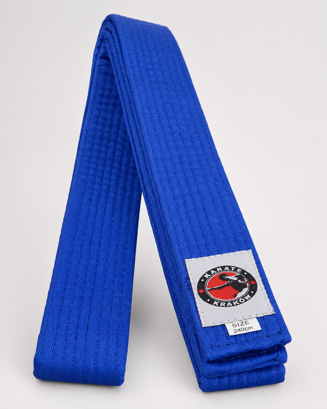 Niebieski pas z logo Karate Kraków